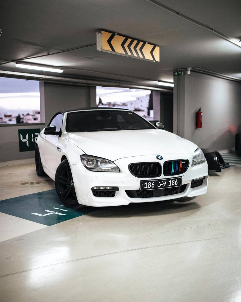 White BMW M6 Convertible in a parking garage