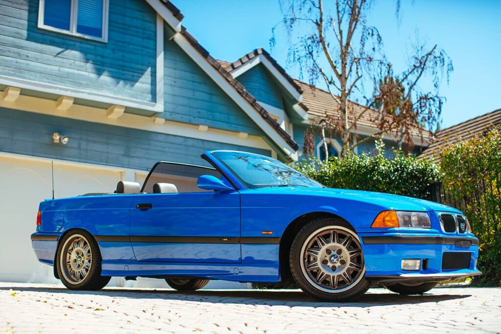 BMW M3 Convertible E36 in Laguna Seca Blue color on a drive way