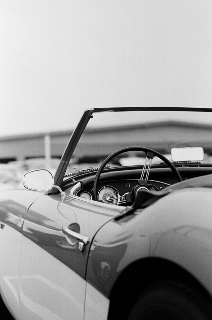open top cabriolet black and white photo